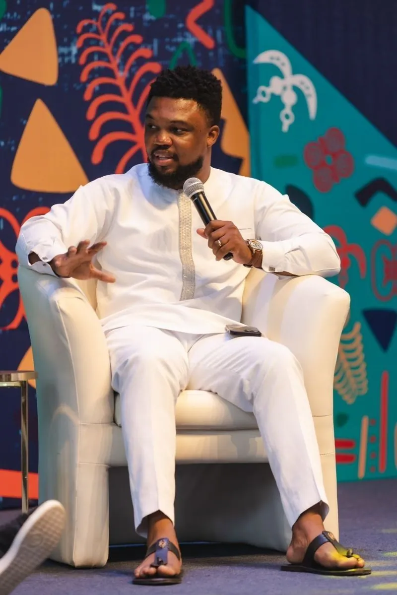 Sydney speaking during a fireside conversation