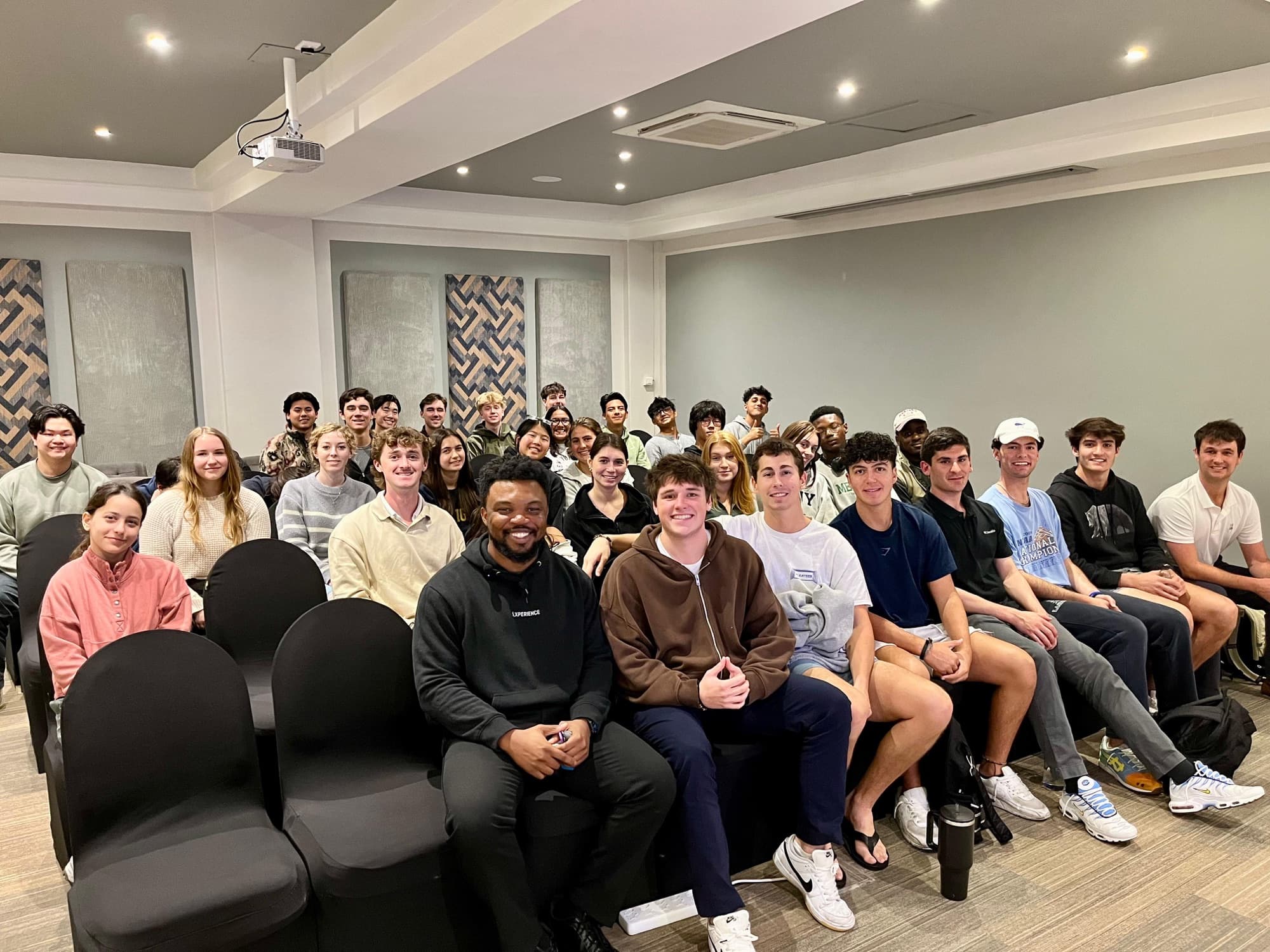 Sydney with a room of students after a session